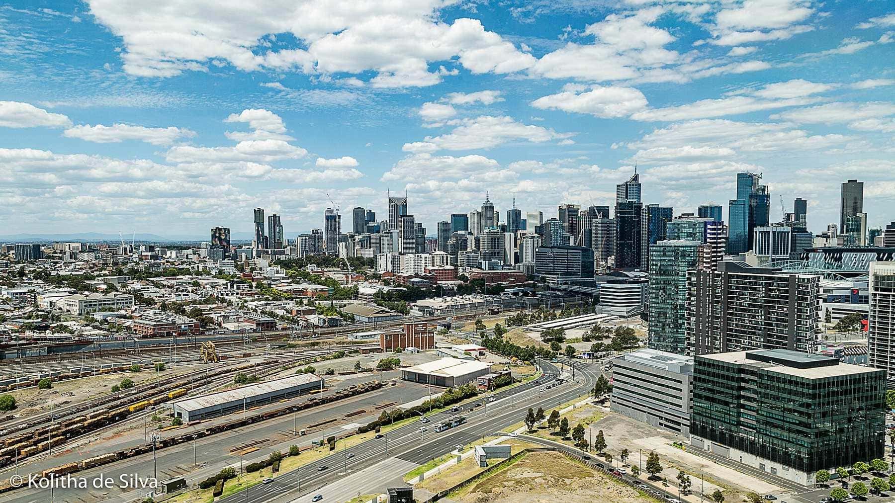 Melbourne city skyline on a sunny day seen across the railyards